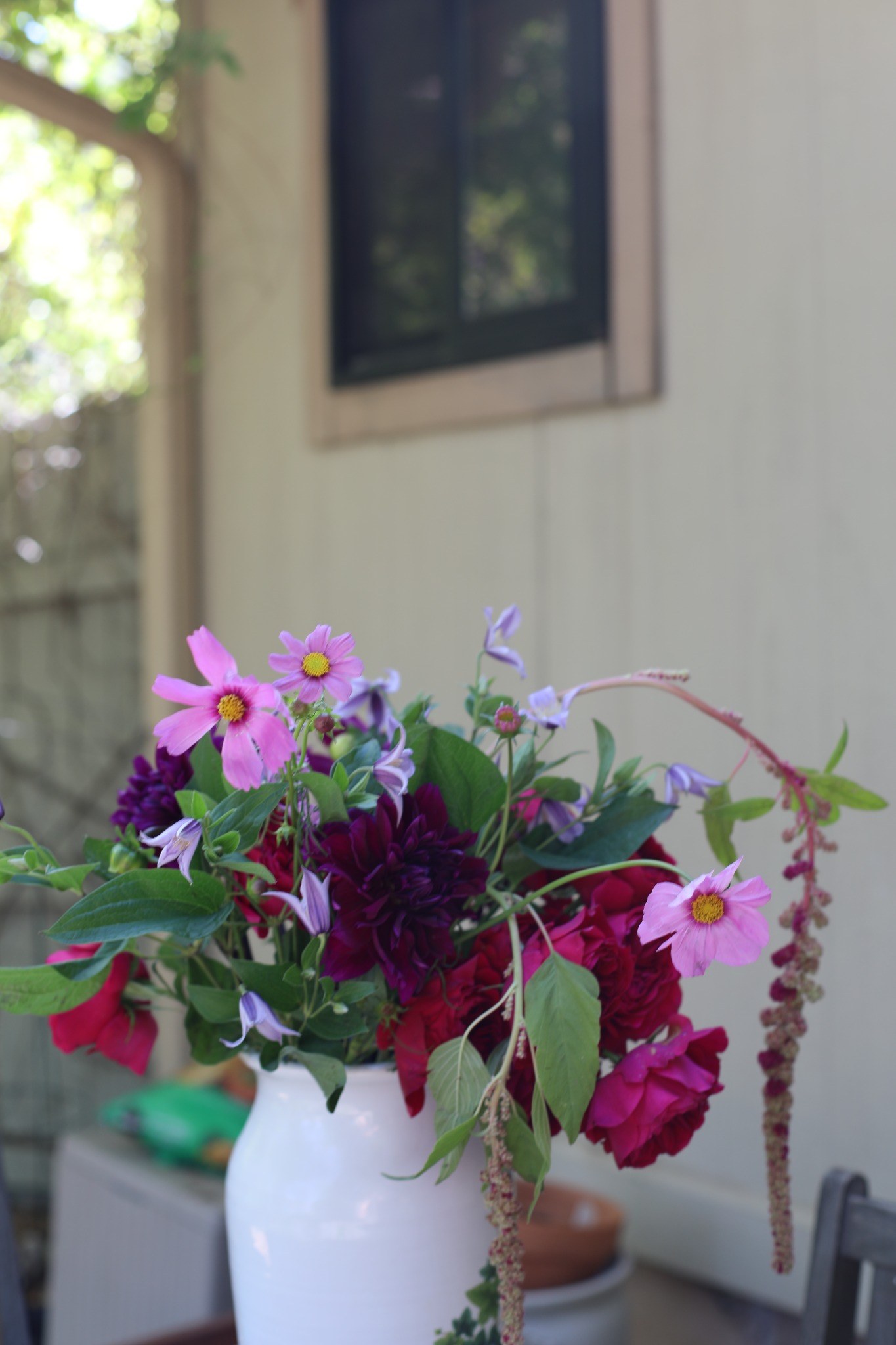 Garden-style Sucker arrangement with pink and purple flowers